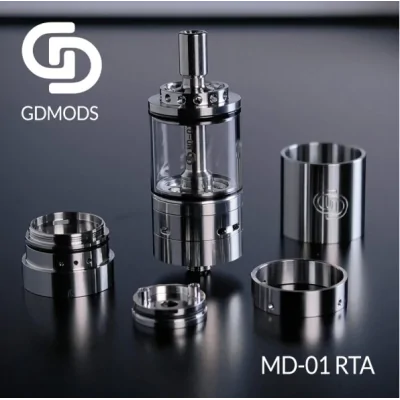 MD-01 RTA 5.5ml 23mm - GD Mods (Selbstwickelverdampfer)GD Mods präsentiert den MD-01 RTA, ein innovatives Design und ein einzigartiges Erlebnis.Single-Coil-Deck für einfache Installation der Coils.Fassungsvermögen von 5,5 ml und Befüllung von unten.Präzise einstellbarer Airflow, perfekt für MTL- bis DL-Züge.2 austauschbare Airflow-Ringe im Lieferumfang enthalten:MTL: 0,8 mm, 1,0 mm, 1,2 mm.DTL: 1,5 mm, 3 x 1,5 mm, 1,5+3 x 1,5 mm.Aus Edelstahl gefertigt.Umfassende Individualisierung dank 2 mitgelieferten austauschbaren Tanks.Außergewöhnliche Geschmacksentfaltung.Abnehmbares 510er Drip Tip.Dank seines Durchmessers von 23 mm mit den meisten Mods kompatibel.16983GD Mods Studio109,90&nbsp;CHFsmoke-shop.ch109,90&nbsp;CHF
