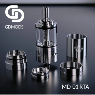 MD-01 RTA 5.5ml 23mm - GD Mods (Selbstwickelverdampfer)GD Mods präsentiert den MD-01 RTA, ein innovatives Design und ein einzigartiges Erlebnis.Single-Coil-Deck für einfache Installation der Coils.Fassungsvermögen von 5,5 ml und Befüllung von unten.Präzise einstellbarer Airflow, perfekt für MTL- bis DL-Züge.2 austauschbare Airflow-Ringe im Lieferumfang enthalten:MTL: 0,8 mm, 1,0 mm, 1,2 mm.DTL: 1,5 mm, 3 x 1,5 mm, 1,5+3 x 1,5 mm.Aus Edelstahl gefertigt.Umfassende Individualisierung dank 2 mitgelieferten austauschbaren Tanks.Außergewöhnliche Geschmacksentfaltung.Abnehmbares 510er Drip Tip.Dank seines Durchmessers von 23 mm mit den meisten Mods kompatibel.2346GD Mods Studio110,30 CHFsmoke-shop.ch110,30 CHF MD-01 RTA 5.5ml 23mm - GD Mods (Selbstwickelverdampfer)GD Mods präsentiert den MD-01 RTA, ein innovatives Design und ein einzigartiges Erlebnis.Single-Coil-Deck für einfache Installation der Coils.Fassungsvermögen von 5,5 ml und Befüllung von unten.Präzise einstellbarer Airflow, perfekt für MTL- bis DL-Züge.2 austauschbare Airflow-Ringe im Lieferumfang enthalten:MTL: 0,8 mm, 1,0 mm, 1,2 mm.DTL: 1,5 mm, 3 x 1,5 mm, 1,5+3 x 1,5 mm.Aus Edelstahl gefertigt.Umfassende Individualisierung dank 2 mitgelieferten austauschbaren Tanks.Außergewöhnliche Geschmacksentfaltung.Abnehmbares 510er Drip Tip.Dank seines Durchmessers von 23 mm mit den meisten Mods kompatibel.2346GD Mods Studio110,30 CHFsmoke-shop.ch110,30 CHF